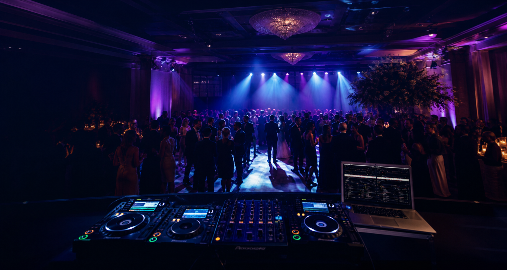 Elegant reception dance floor illuminated by professional event lighting